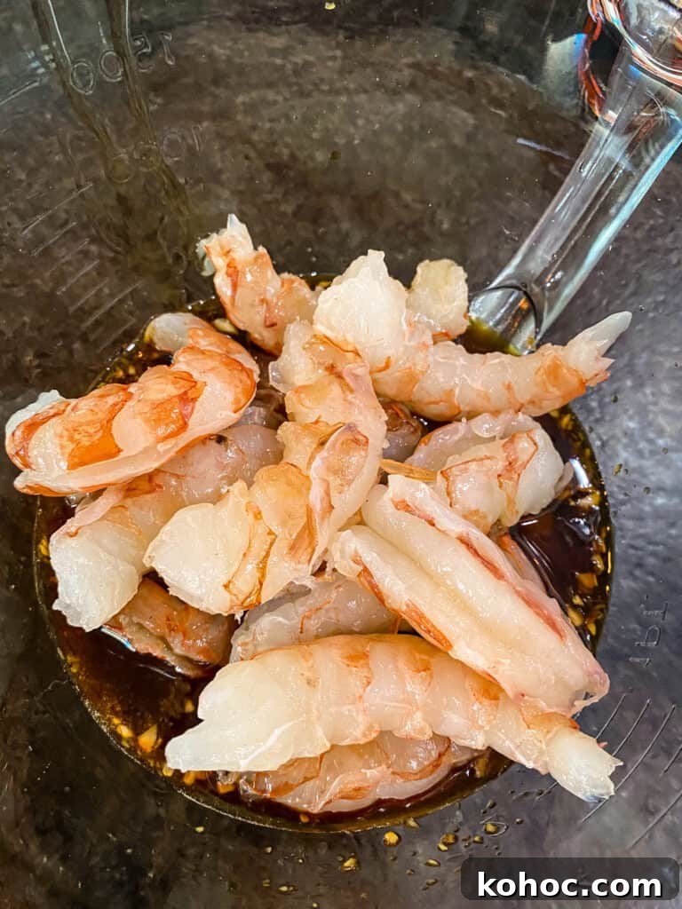 10-Minute Sweet Spicy Shrimp Recipe for Weeknight Dinners 3 shrimp going in the sweet and spicy grilled shrimp marinade