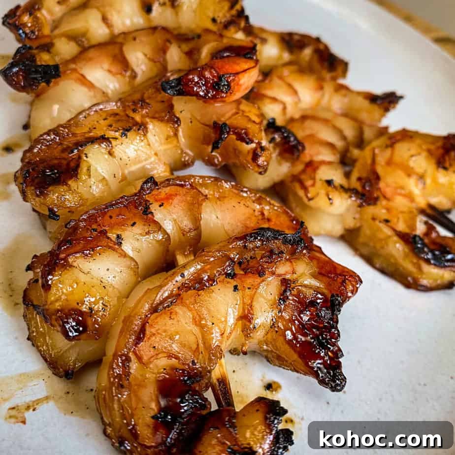 10-Minute Sweet Spicy Shrimp Recipe for Weeknight Dinners 5 sweet and spicy grilled shrimp on a plate
