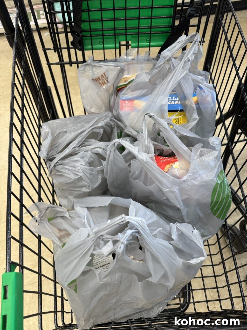Thanksgiving Dinner Ideas Using Dollar Tree Finds 3 A shopping cart full of groceries in gray plastic bags.