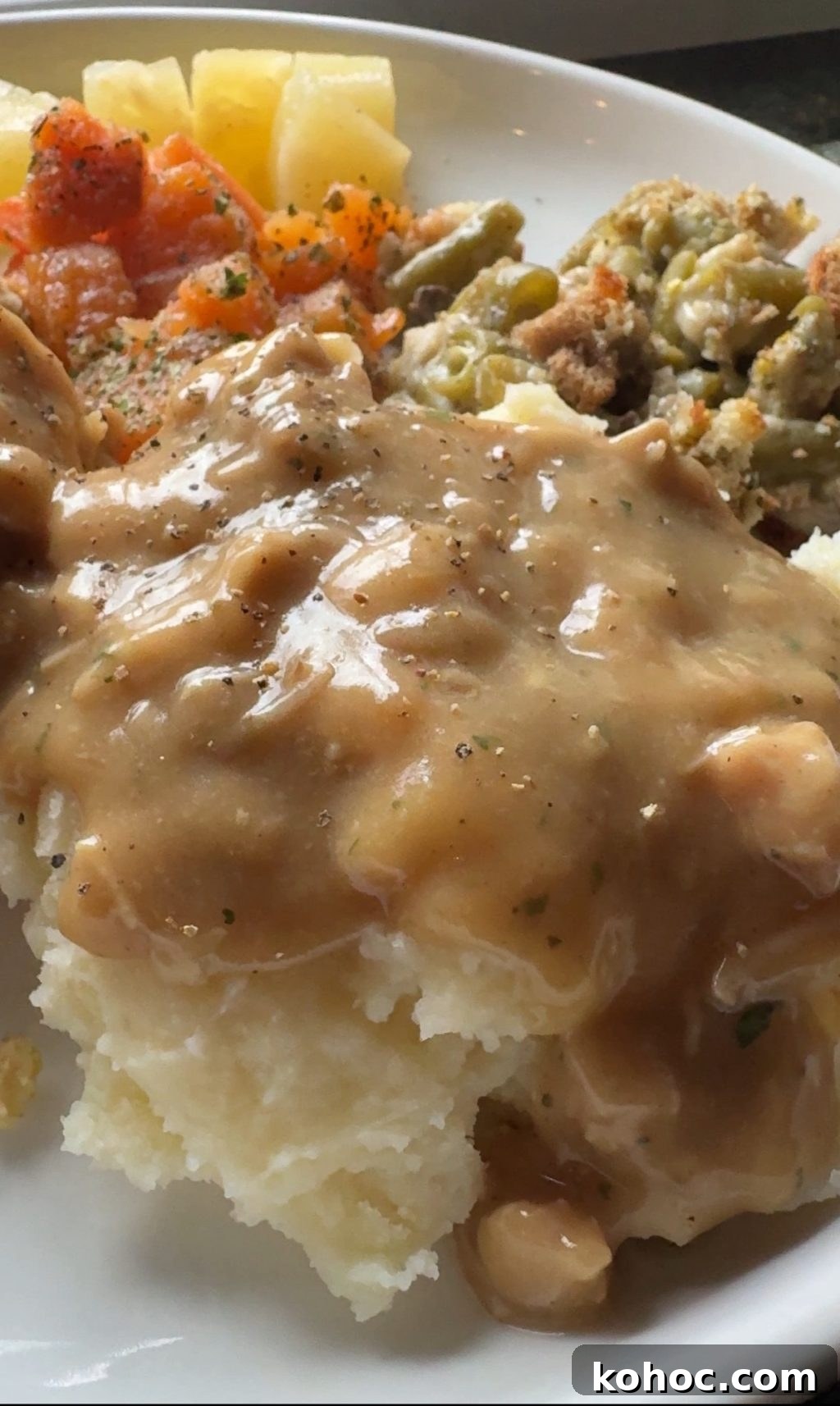 Thanksgiving Dinner Ideas Using Dollar Tree Finds 6 A close up of mashed potatoes covered in gravy.
