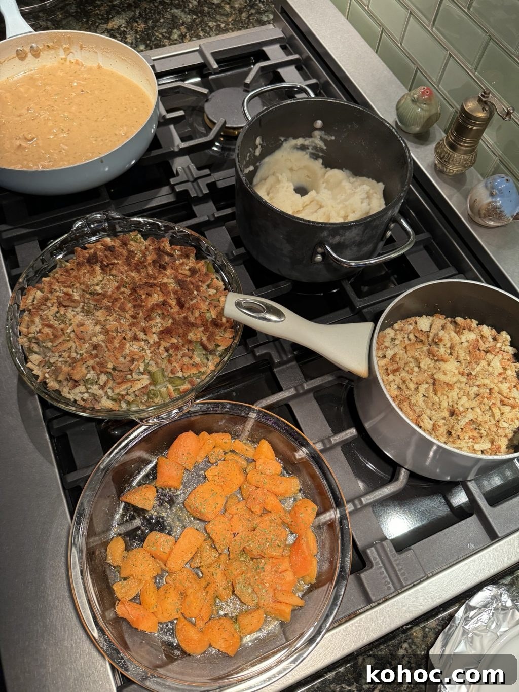 Thanksgiving Dinner Ideas Using Dollar Tree Finds 8 Sweet potatoes, green bean casserole, mashed potatoes, stuffing, and gravy in pots, pans, and dishes on the stove.