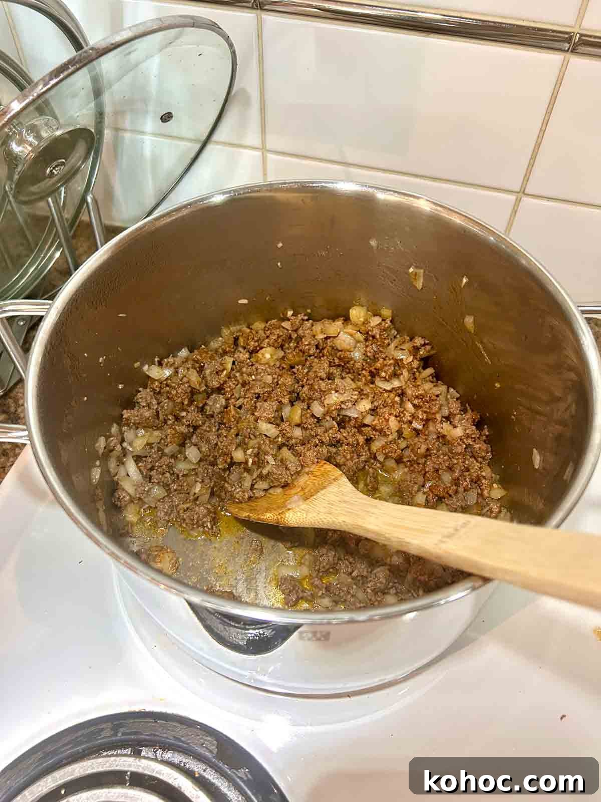 Creamy Chicken Taco Soup Recipe for Cozy Weeknight Meals 5 taco seasoning added to ground beef, garlic, and onions.