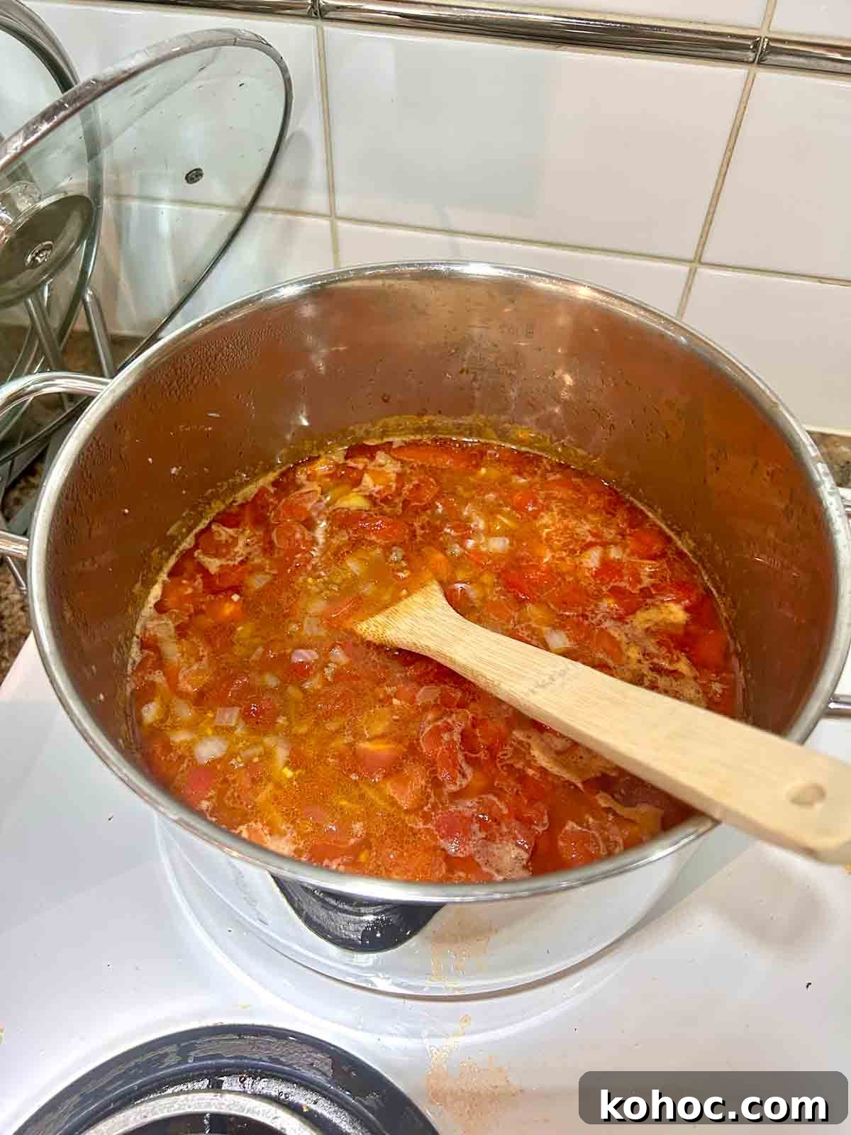 Creamy Chicken Taco Soup Recipe for Cozy Weeknight Meals 6 chicken broth and diced tomatoes added and simmered in pot.