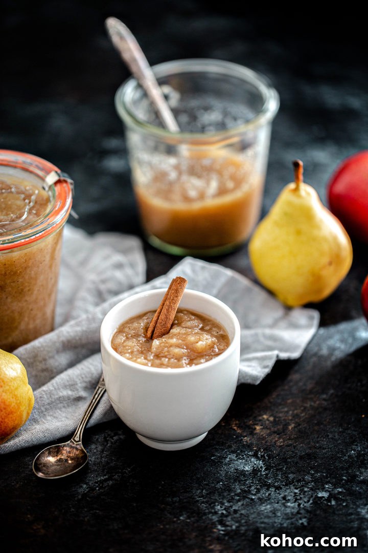 Homemade Pear Sauce Recipe: Smooth, Sweet, and Simple 7 a bowl of pear sauce next to two jars
