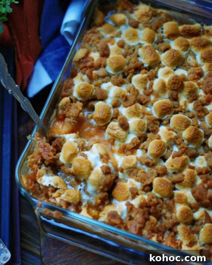 classic sweet potato casserole with marshmallow topping for holidays or Sunday dinner side dish