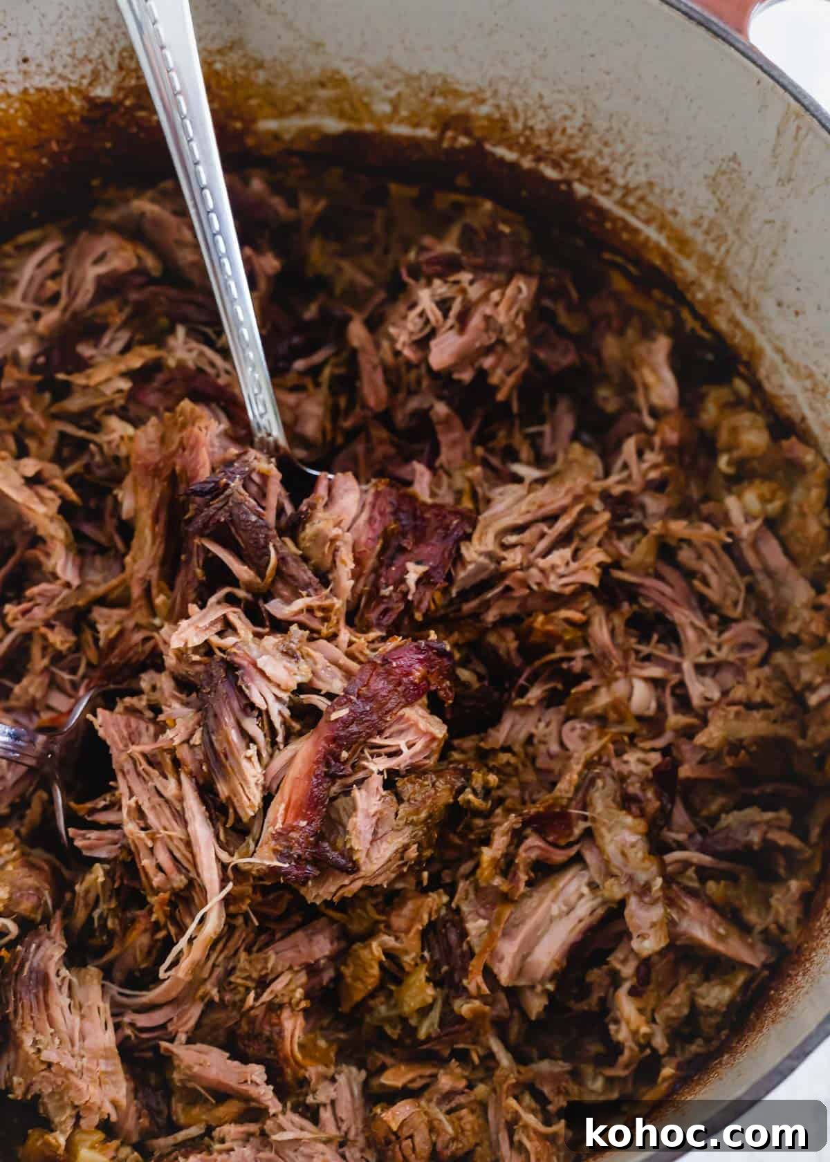 Tender, juicy and shredded braised leg of lamb in a Dutch oven. Tender, juicy and shredded braised leg of lamb in a Dutch oven.