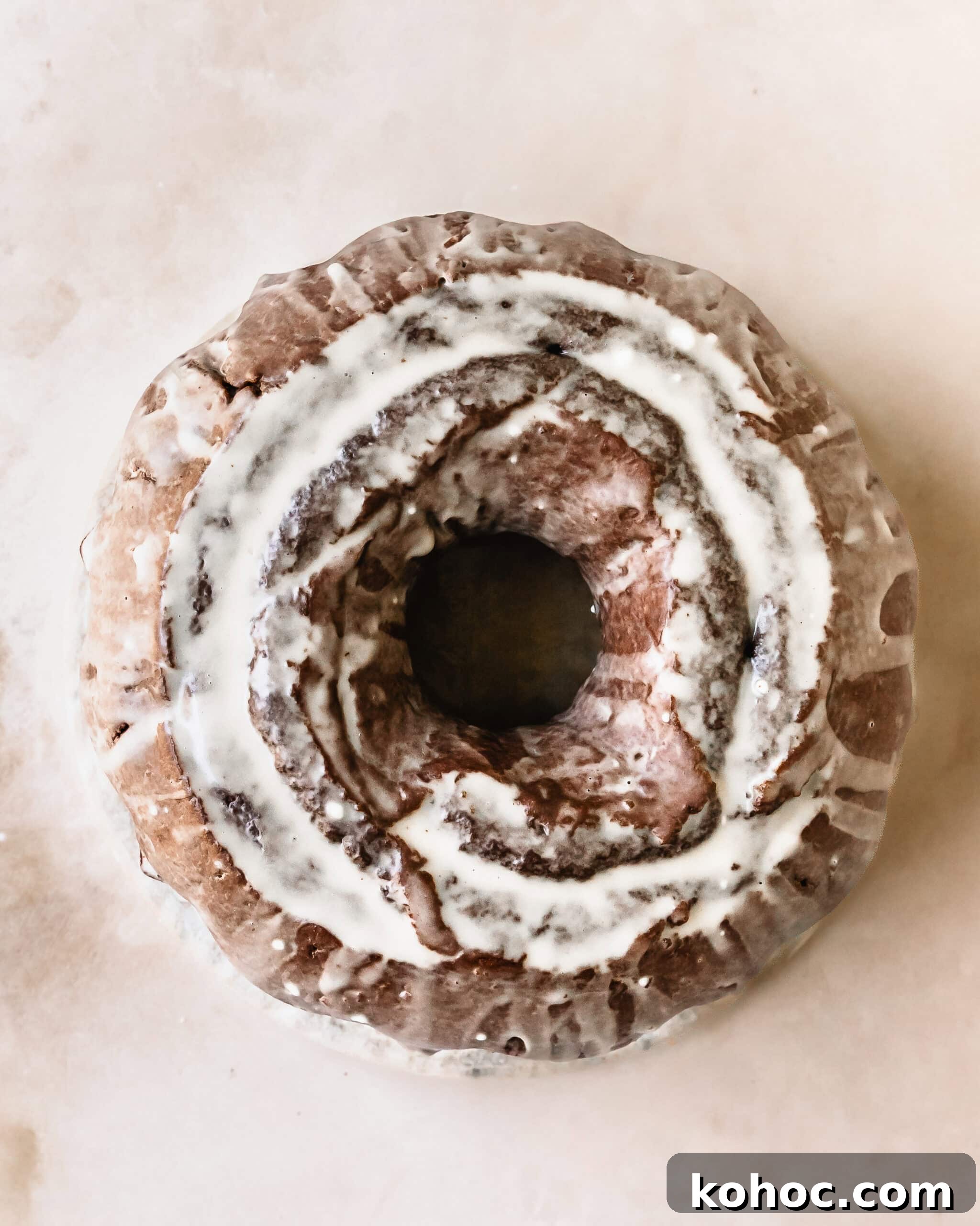 Decadent Chocolate Donut Cake Recipe: Moist Layered Chocolate Cake 2 Chocolate donut cake is a rich, moist and tender chocolate cake shaped like an oversized old fashioned chocolate cake donut. Top with this old fashioned chocolate cake donut with a sweet and creamy vanilla glaze. It’s the perfect easy to make and decadent dessert everyone will love.