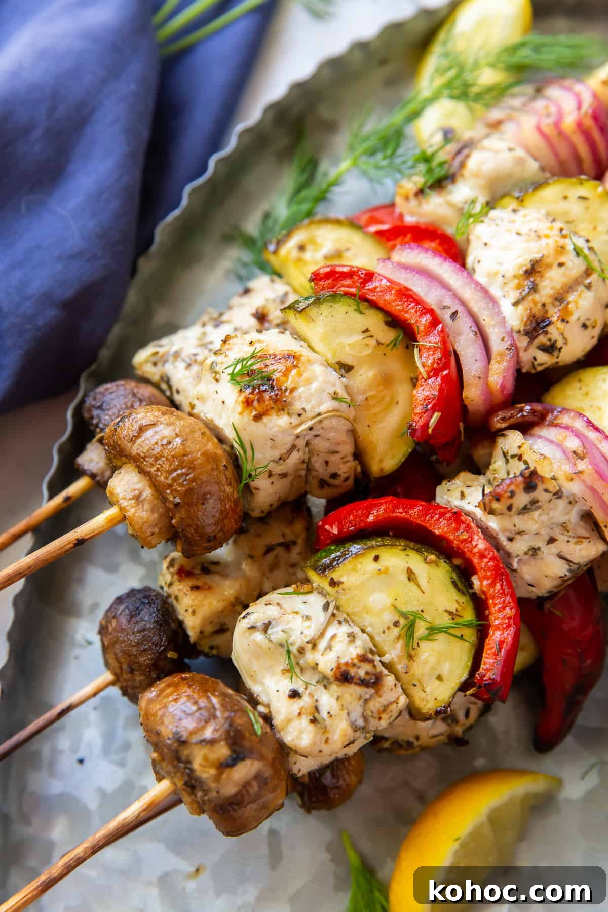 Greek Chicken Kabobs Recipe with Tzatziki and Grilled Vegetables 9 A closeup of Greek Chicken and vegetable kabobs.