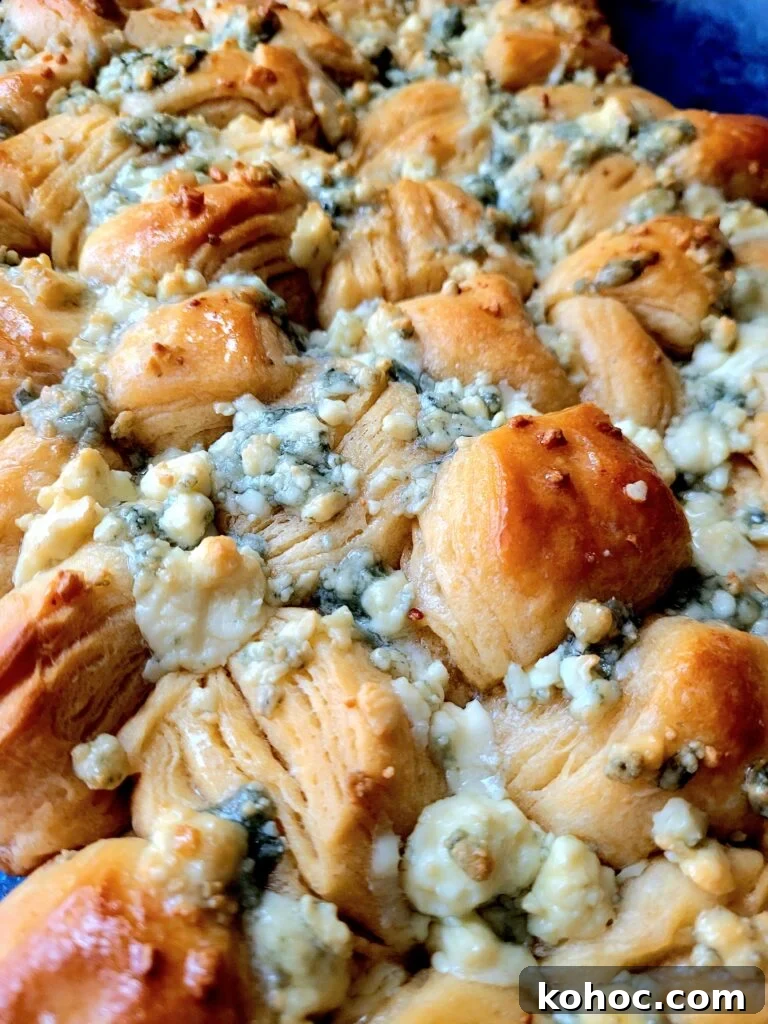 Savory Blue Cheese Biscuits Recipe for Crispy, Flaky Biscuits 3 pan of blue cheese biscuits covered in crumbled blue cheese