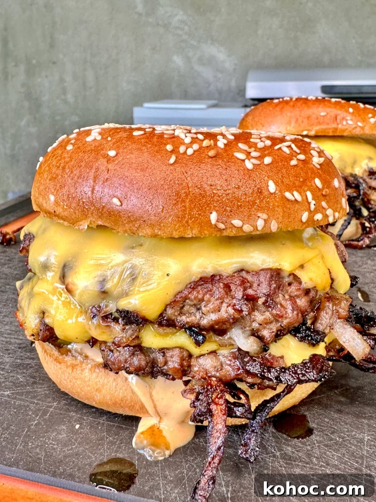 Top Grilled Burger Recipes for Flavorful Summer BBQs 2 smash burgers on a cutting board