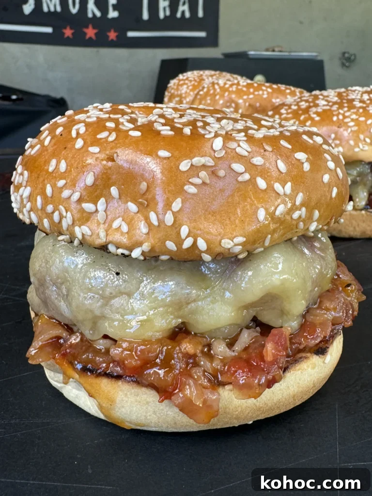 smoked bacon jam burgers on a cutting board