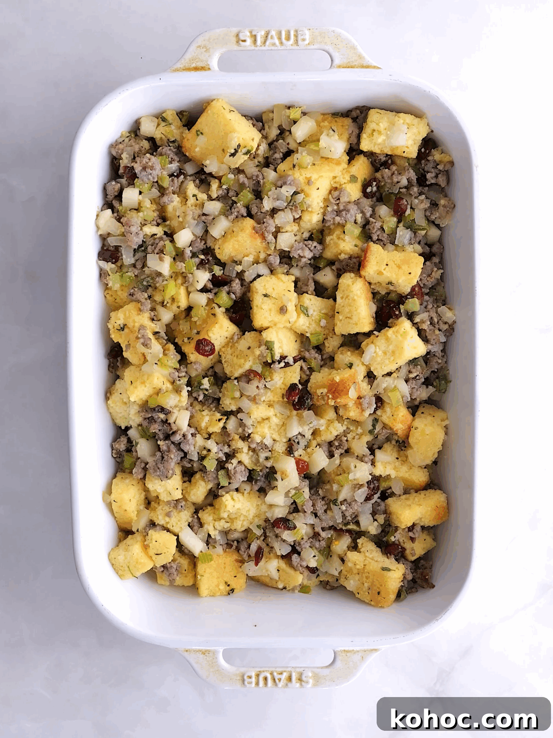 Sausage, Apple & Cranberry Cornbread Dressing Recipe 5 cornbread dressing in a baking dish