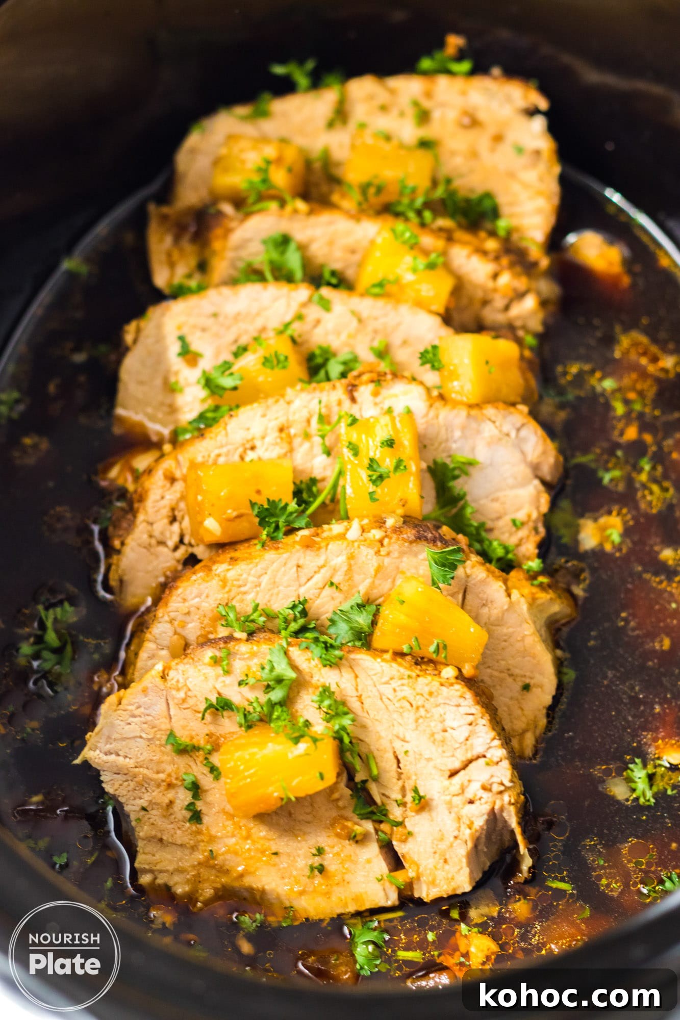 Pineapple Pork Loin Slow Cooker Recipe for Tender, Juicy Meat 2 Sliced Pineapple Pork Loin with pineapple chunks in the slow cooker