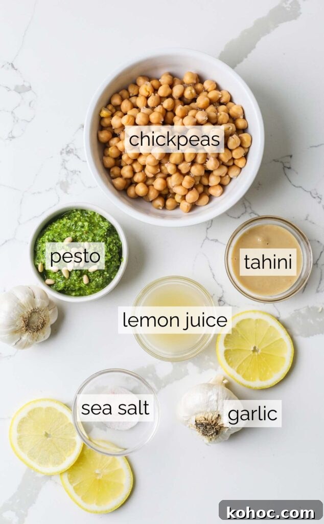 The ingredients needed to make a basil pesto hummus.