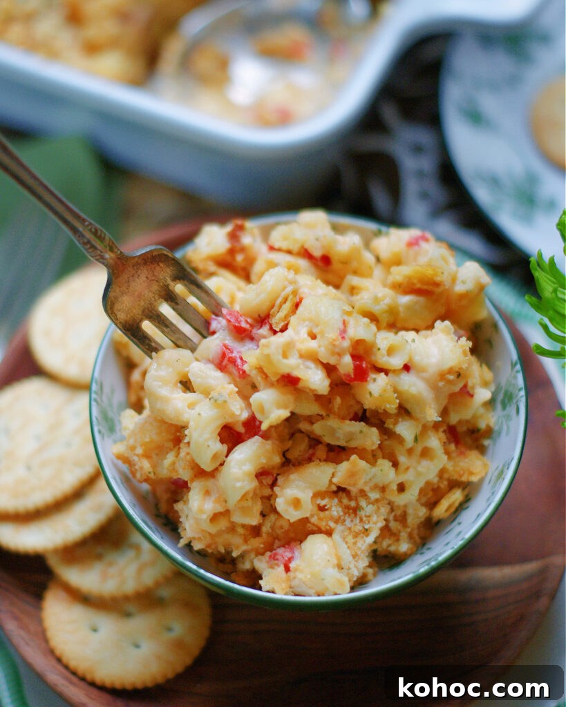 Southern Pimento Mac and Cheese Recipe with Creamy Cheese Sauce 3 A bowl of macaroni and cheese made with the southern flavors of pimento cheese.