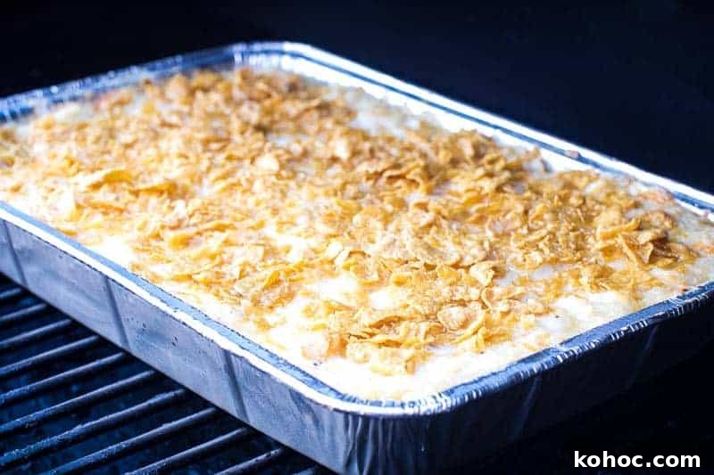 Traeger Cheesy Potato Casserole on smoker
