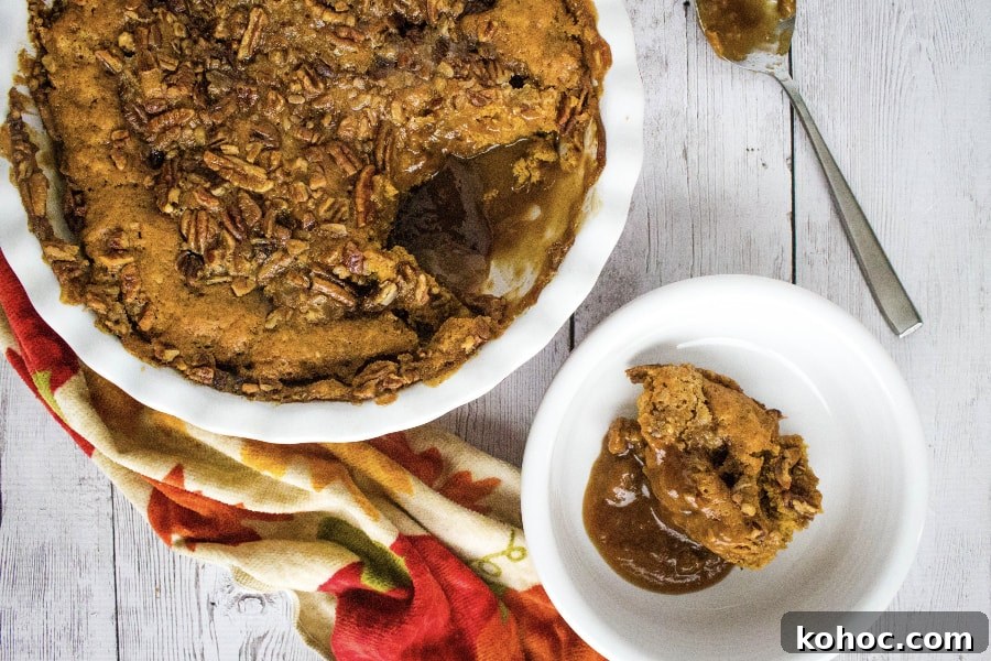 Irresistible Pumpkin Cobbler Recipe for Fall Gatherings 8 pumpkin cobbler in a white bowl next to the baking dish full of pumpkin cobbler