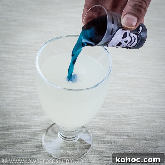 Vegan Color-Changing Witches' Brew Halloween Punch 12 Witches' Brew -- Color Changing Halloween Drink; Pouring the Drink | Low-Carb, So Simple!