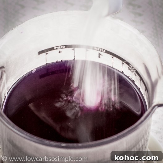 Vegan Color-Changing Witches' Brew Halloween Punch 4 Witches' Brew -- Color Changing Halloween Drink; Adding the Baking Soda to the Red Cabbage Extract | Low-Carb, So Simple!
