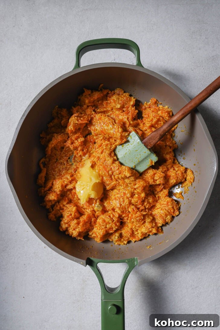 Ghee added to Carrot Halwa.