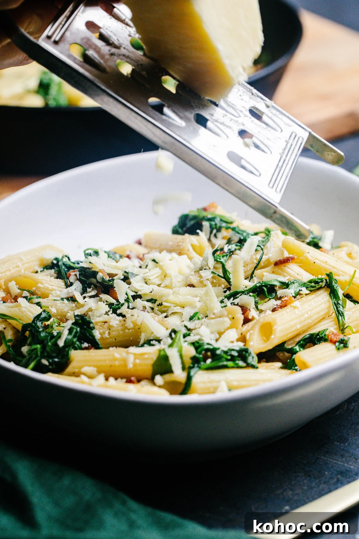 Creamy Pancetta Pasta with Parmesan and Peas 5 Grating cheese over Pancetta Pasta.