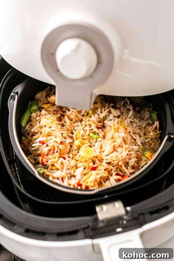 Crispy Air Fryer Fried Rice Recipe for Quick Weeknight Meals 2 Fried rice in an air fryer. It can compete with any restaurant fried rice. On the table in no time and a great side dish to serve with dinner.