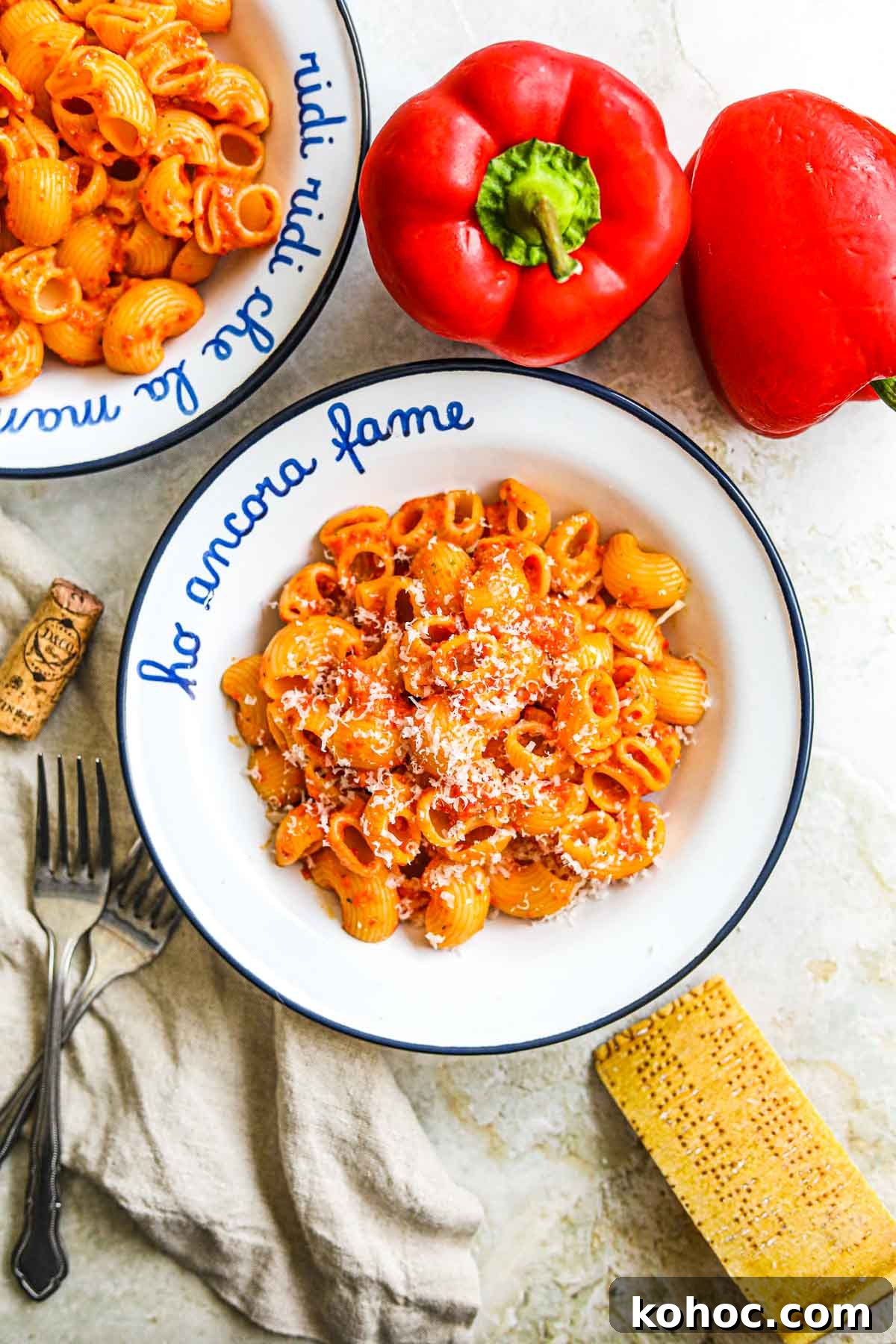Roasted Red Pepper Pesto Pasta Recipe for Flavorful Weeknights 2 Roasted red pepper pesto pasta in a bowl with roasted red bell pepper and parmigiano-reggiano.