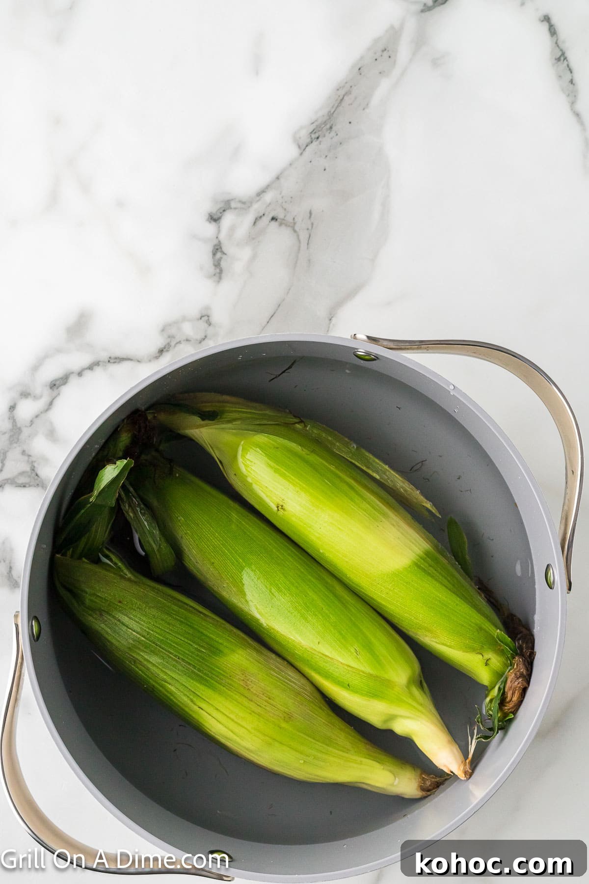 Blackstone Grilled Corn on the Cob in the Husk - Juicy BBQ Flavor 4 Corn on the cob in a large pot of water