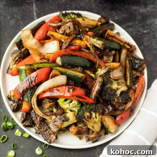 Blackstone Grilled Corn on the Cob in the Husk - Juicy BBQ Flavor 10 Chinese stir fry vegetables on a plate.