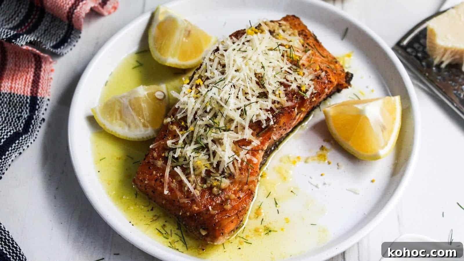 25 Skillet Meals Ready in 30 Minutes or Less 18 A plate of salmon on a white plate with lemon slices on it.