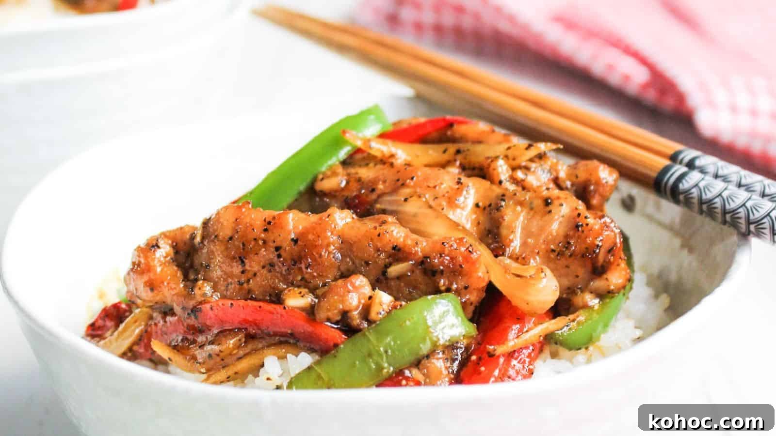 25 Skillet Meals Ready in 30 Minutes or Less 20 Bowl of black pepper chicken with chop sticks.