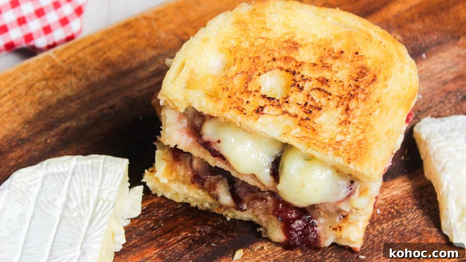25 Skillet Meals Ready in 30 Minutes or Less 21 Grilled cheese sandwich with melted cheese and cranberry sauce on a wooden board.