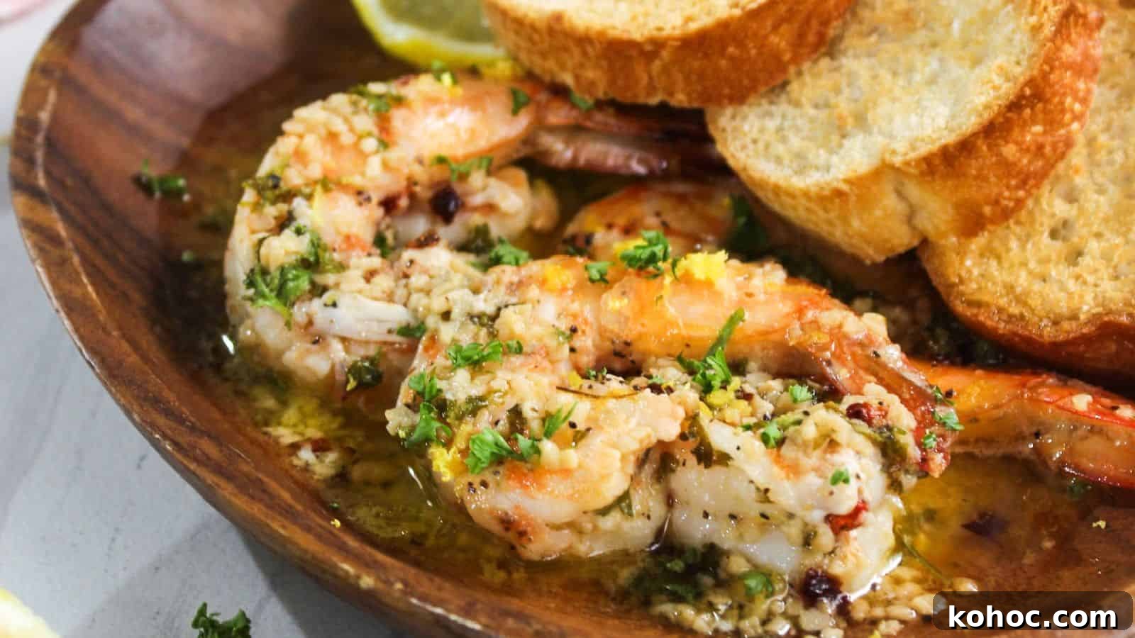 25 Skillet Meals Ready in 30 Minutes or Less 26 A plate with shrimp and bread on it.