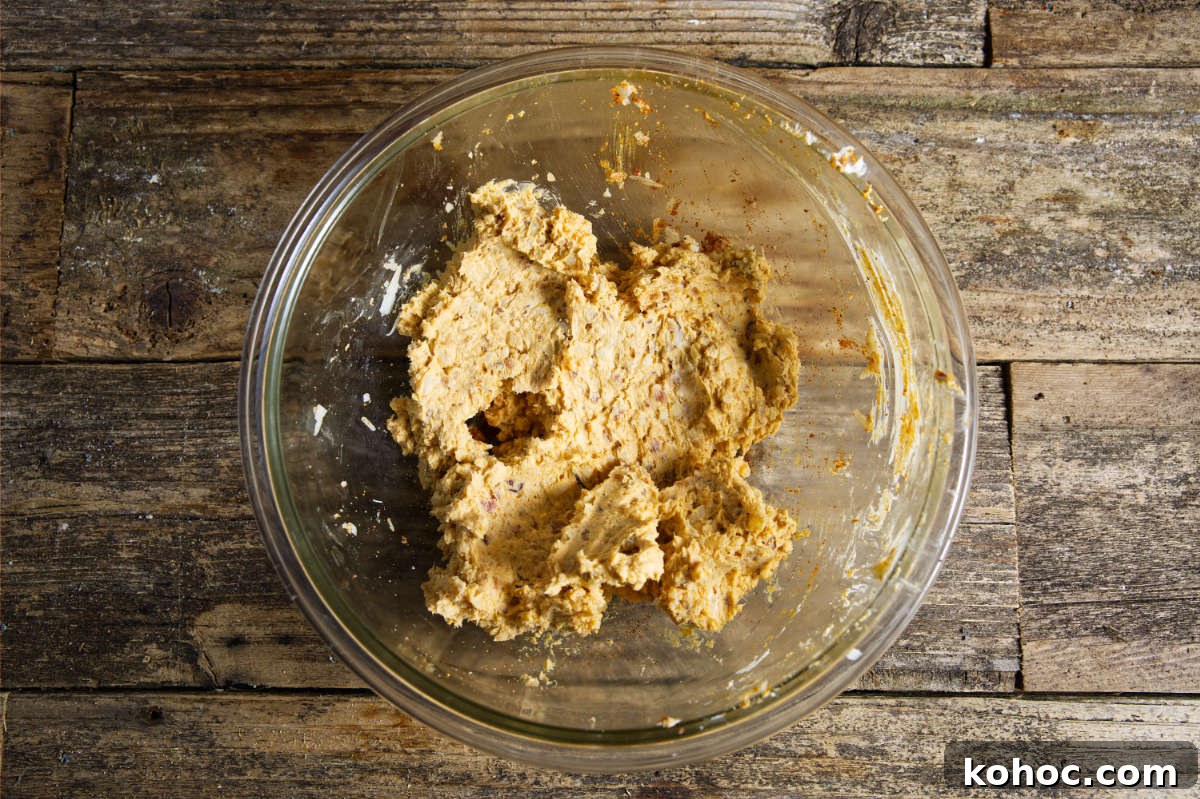 Crispy Air Fryer Shishito Peppers with Zesty Lemon Dip 6 cheese mixture in a glass bowl