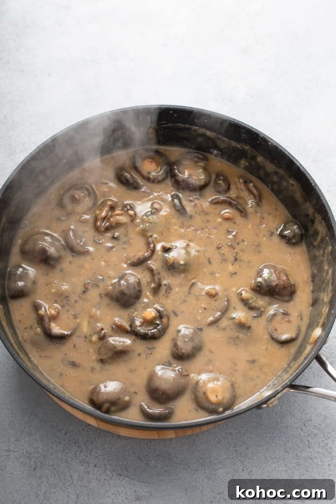 Savory Mushroom Vegan Gravy Recipe for Holiday and Everyday Meals 9 Mushroom gravy in a skillet