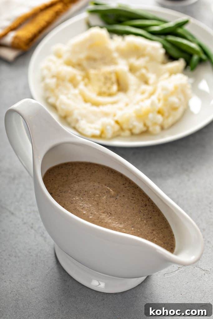 Savory Mushroom Vegan Gravy Recipe for Holiday and Everyday Meals 3 Creamy and smooth vegan gravy in a gravy boat.