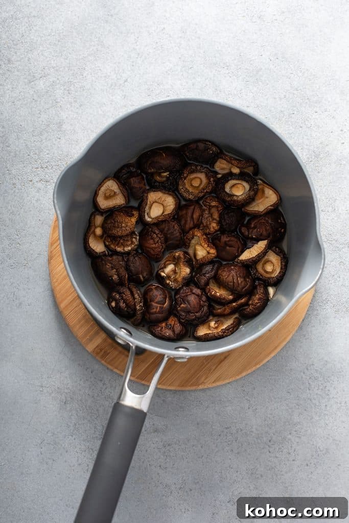 Savory Mushroom Vegan Gravy Recipe for Holiday and Everyday Meals 5 Rehydrating dried mushrooms in a small saucepan