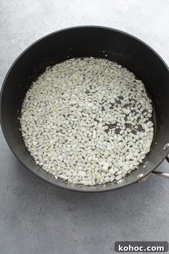 Savory Mushroom Vegan Gravy Recipe for Holiday and Everyday Meals 6 Sautéing diced onions in a skillet