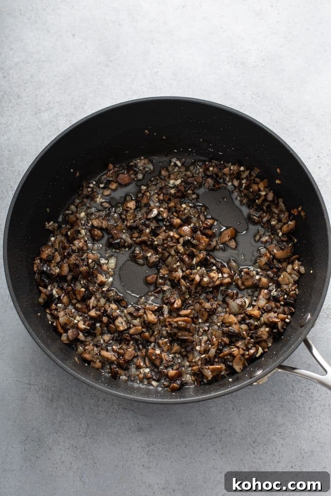 Savory Mushroom Vegan Gravy Recipe for Holiday and Everyday Meals 7 Sautéing onions and mushrooms in a skillet
