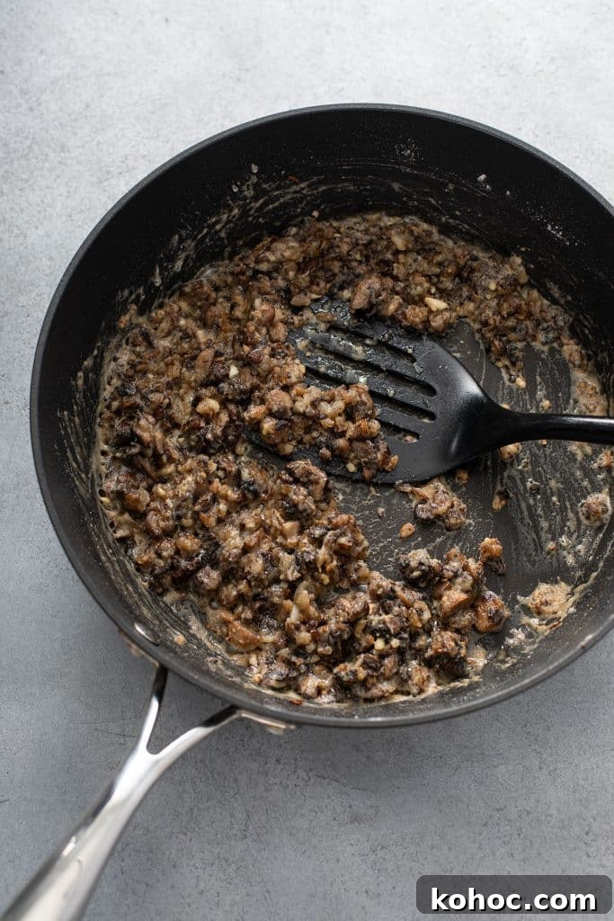 Savory Mushroom Vegan Gravy Recipe for Holiday and Everyday Meals 8 Making a roux for mushroom gravy in a skillet