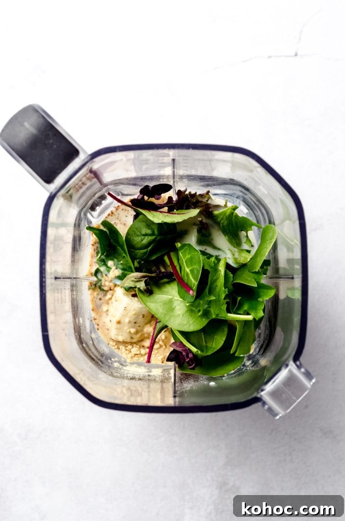 Aerial photo of a blender with ingredients in it to make a breakfast smoothie.