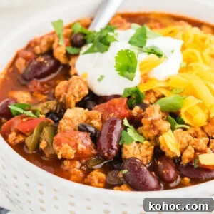 Hearty Ground Chicken Chili Recipe for Weeknight Dinners 10 Ground chicken chili recipe in a bowl with cheese
