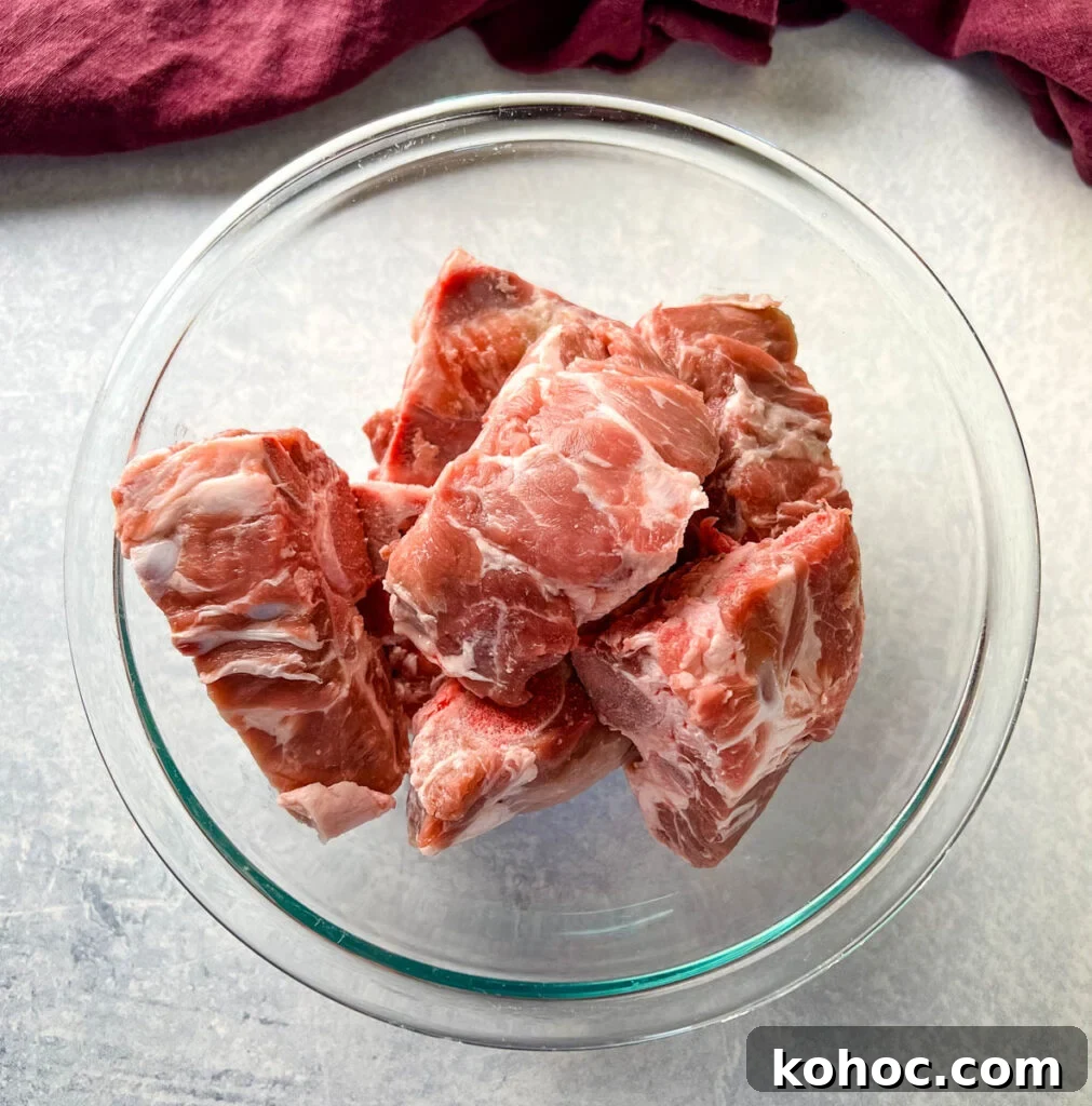 raw pork neck bones in a glass bowl