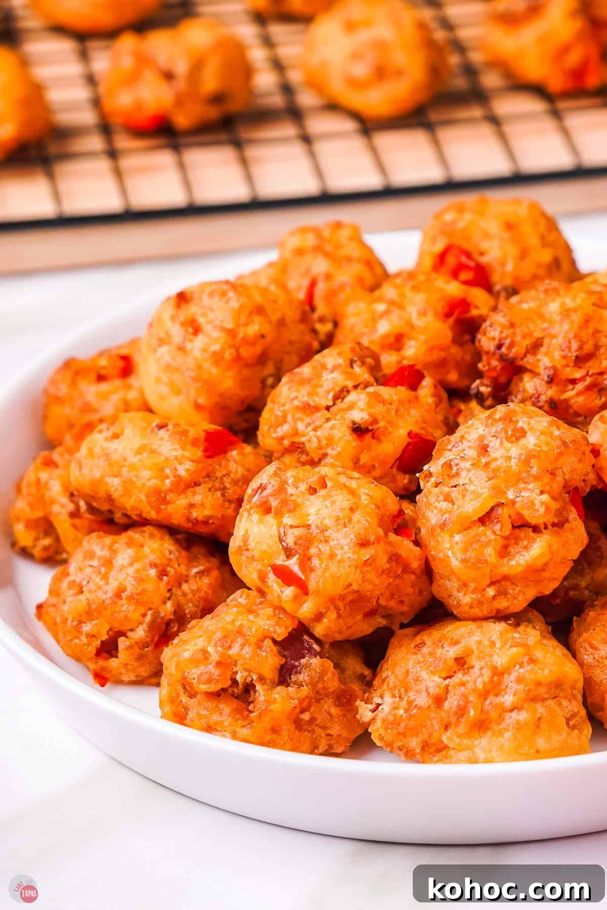 Pimento Cheese Sausage Balls: Southern Party Appetizer Recipe 2 pimento red pepper with breakfast sausage in balls on a plate