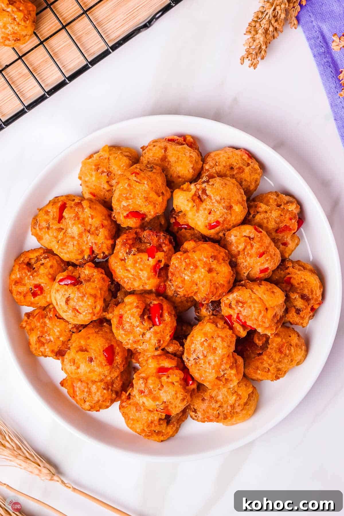 Pimento Cheese Sausage Balls: Southern Party Appetizer Recipe 8 overhead picture of sausage balls on a plate