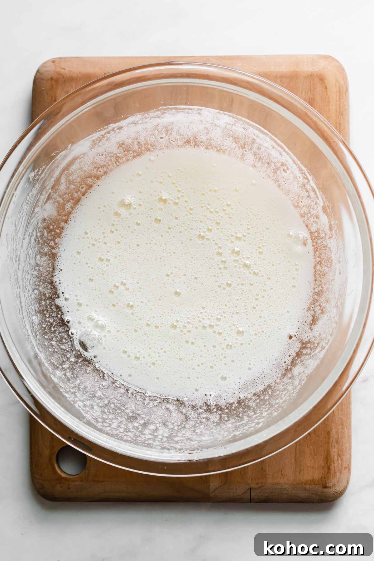 Heated and whisked egg whites and sugar in a bowl.