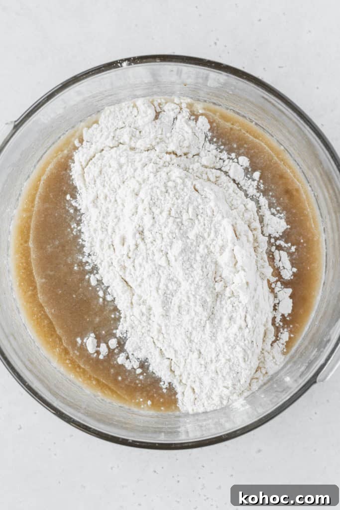 Wet ingredients and dry ingredients mixed together in a bowl.