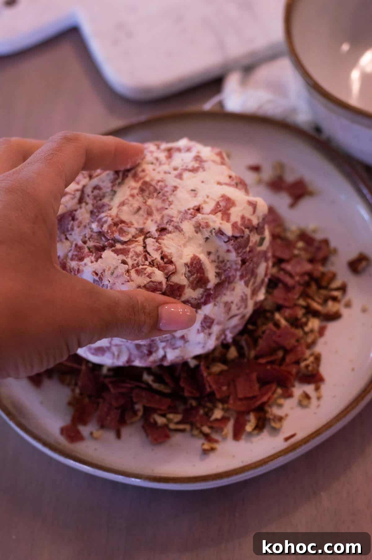 Savory Beef Cheeseball Appetizer Recipe 7 beef cheeseball being rolled in dried beef