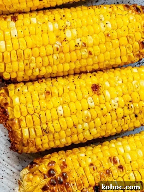 picture of grilled corn on the cob on a plate