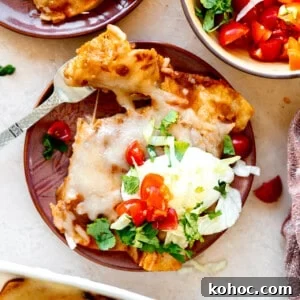 Tex-Mex Cheese Enchiladas with Melted Cheddar and Salsa Verde 8 Plate of cheese enchiladas with Tex Mex chili gravy ad topped with sour Cream, shredded lettuce, diced tomatoes and fresh cilantro.